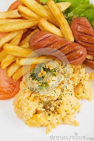 Scrambled eggs, sausage and french fries Stock Photo