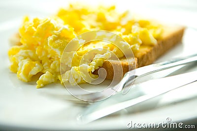 Scrambled eggs on toast Stock Photo