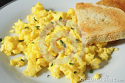 Scrambled eggs with toast Stock Photo