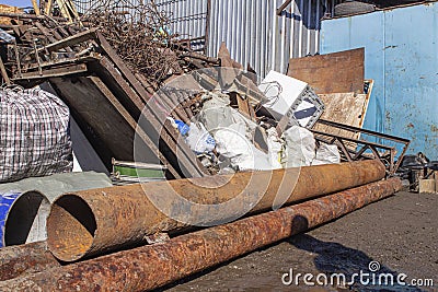 Scrap metal collection point with floor scales in early spring during the steel price increase season Editorial Stock Photo