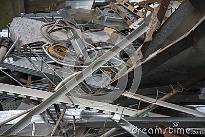 Scrap metal dump, a pile of twisted and unnecessary metal parts, separate garbage collection. Stock Photo