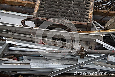 Scrap metal dump, a pile of twisted and unnecessary metal parts, separate garbage collection. Stock Photo