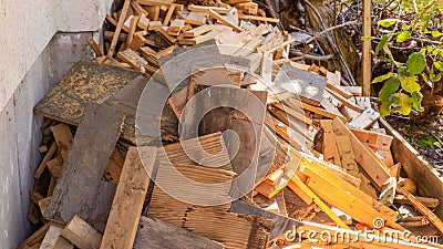 Scrap wood and lumber cuttings for firewood or junk removal service, in a pile. Useful for recycling projects or firewood, as Stock Photo