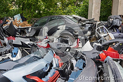 Scrapyard of bumpers. Motor-car dump, cemetery Stock Photo