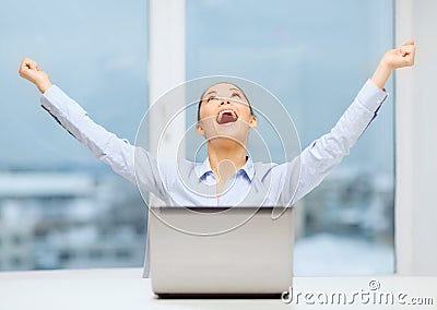 Screaming businesswoman with laptop in office Stock Photo
