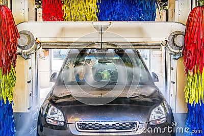 Screaming kid in car at carwash Stock Photo