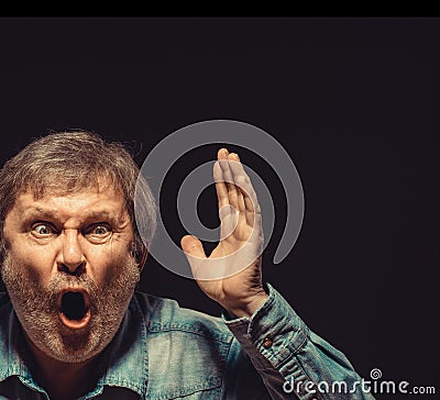 The screaming man in denim shirt Stock Photo