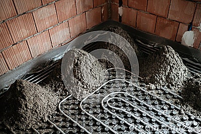 Screed details. Construction site details, mortar and underfloor heating Stock Photo