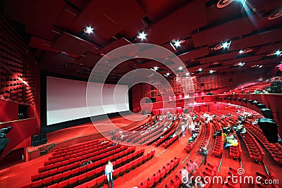 Screen and rows of chairs in cinema Stock Photo