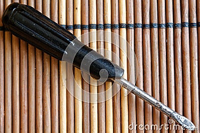 Screwdriver flat mouth on wooden background, Flat-blade screwdriver Stock Photo