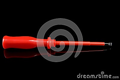 Screwdriver flat. Workshop tools. Reflection in black glass. Stock Photo