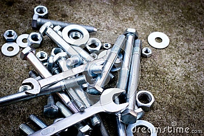 Screws, bolt, metal nuts, canvas, wrench to unscrew Stock Photo