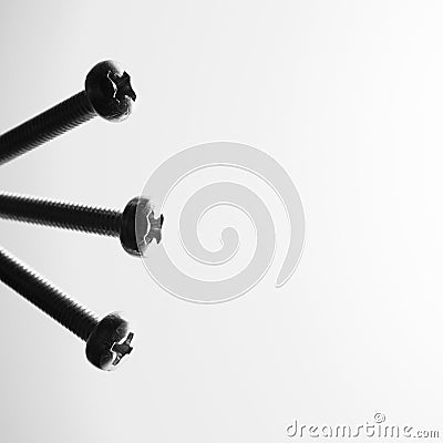 screws on a grey background Stock Photo