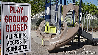 Scribbled notes of protest on a closed playground sign during Covid-19 shutdown. Stock Photo