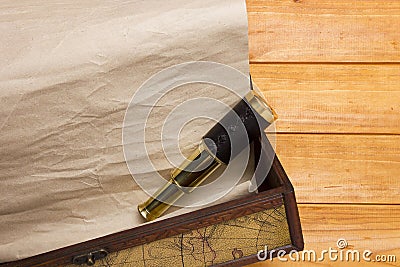 Scroll and telescope in the old box Stock Photo