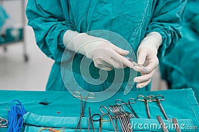 Scrub nurse prepare medical instruments for surgery Stock Photo