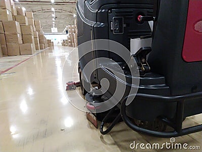Scrubber drier for cleaning storage facilities. Close-up.Floor polisher.Floor cleaning machine. Floor maintenance. Stock Photo