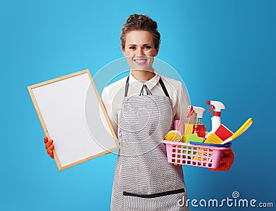 Scrubwoman with a basket with cleansers and brushes Stock Photo