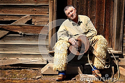 Scruffy Cowboy on Stoop Stock Photo