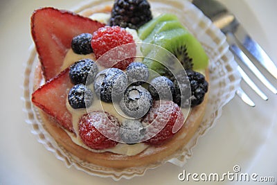 Scrumptious looking detail in fresh fruit tart Stock Photo