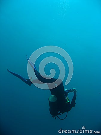 Scuba diver descending sipadan island Stock Photo