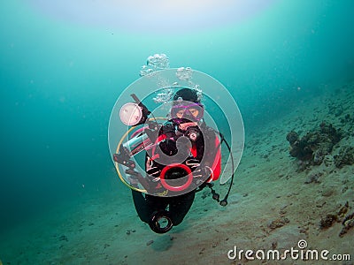 Scuba diver doing underwater photography in Anilao Philippines Editorial Stock Photo