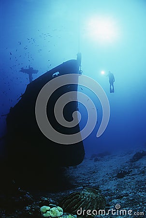 Scuba Diver Exploring Sunken Ship Stock Photo