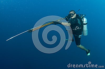 Scuba diver with Harpoon gun Stock Photo