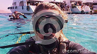 Scuba diver woman making selfie in the water after diving Stock Photo