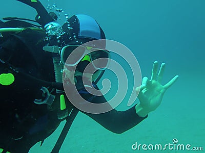 Scubadiver sign ok Stock Photo