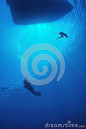 Scuba diver in blue water Stock Photo