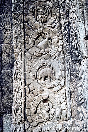 Sculpted stone depicting a dinosaur at the ancient Ta Prohm temple at Angkor Wat. Stock Photo