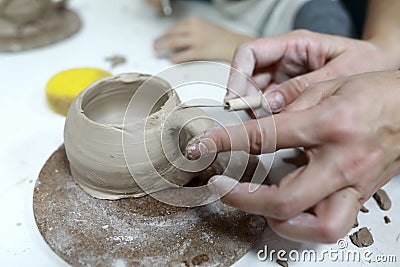 Sculptor sculpts clay mug Stock Photo