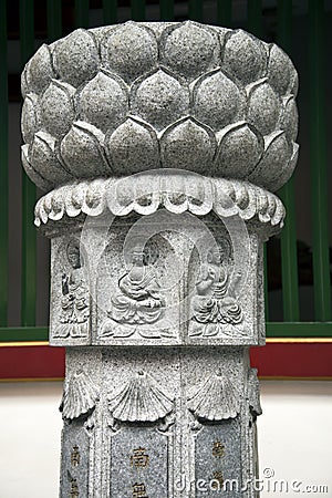 Sculpture with buddhist symbolism Stock Photo