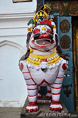 Sculpture carving ancient stone napali lion singha guardian statue at antique old antique Chok Hanuman Dhoka Royal Palace at Stock Photo