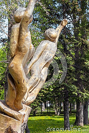 sculpture of the Cosmonauts carved from old wood in Gagarin park Editorial Stock Photo
