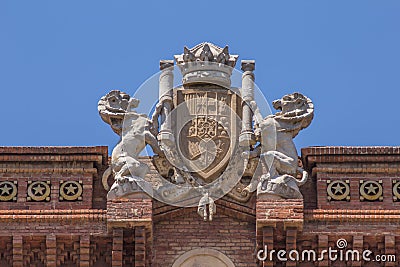Sculpture and crest atop the Arc de Triomf in Barcelona, Spain Stock Photo
