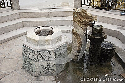 Sculpture dragon stone fountain in garden at outdoor Stock Photo