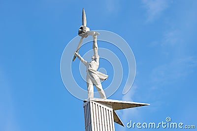 The sculpture of the engine manufacturer, up over the head of the plane. Rybinsk, Yaroslavl region Editorial Stock Photo
