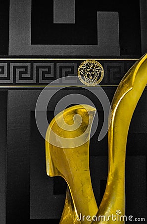 Sculpture gold versace wall Editorial Stock Photo