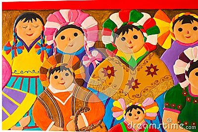 Sculpture of a group of colorful mexican women on the wall Stock Photo