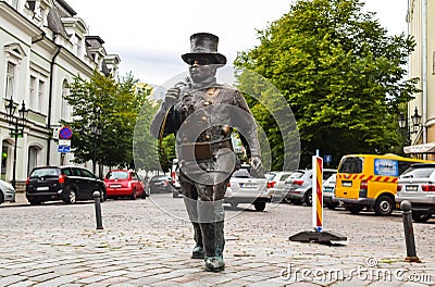 Sculpture of a happy chimney sweep in front of the Soprus cinema in the old town Editorial Stock Photo