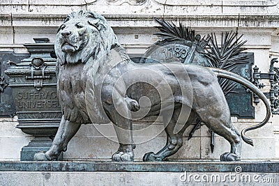 Sculpture of a lion in front of the symbols of the French Revolution and universal suffrage Stock Photo
