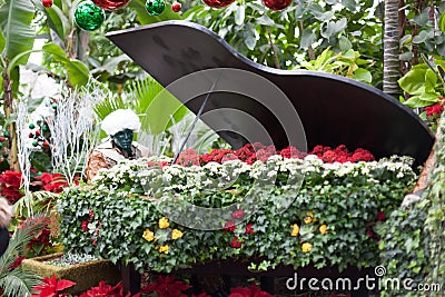 Sculpture of man playing a piano alone in Allan Stock Photo