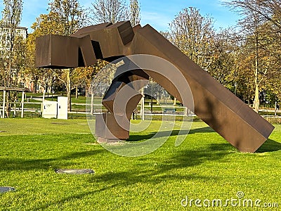 Sculpture `Monumento` also called `Rumor de lÃ­mites IX` art by Eduardo Chillida in Hofgarten, Dusseldorf Editorial Stock Photo