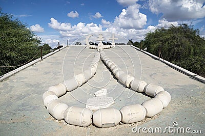 Sculpture of praying bracelett for Islam and Christianity, unioned in with the lebanese cedar, Tyre, Sour, Lebanon Stock Photo