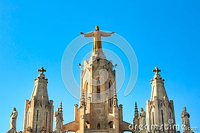 Sculpture of the Sacred Heart of Jesus on the Sagrat Cor church in Tibidabo mountain over Barcelona, Spain Editorial Stock Photo