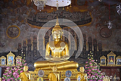 A sculpture of a seated Buddha in the temple of Wat Rakhang Khositaram Ubosot. Bangkok, Thailand Stock Photo