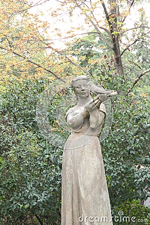 Sculpture woman with bird Editorial Stock Photo