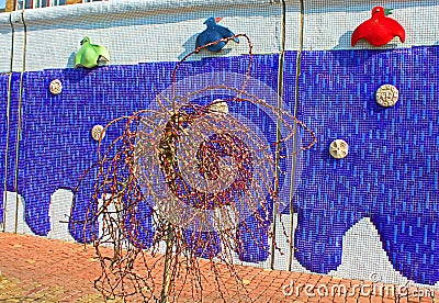 Sculptured panel of colorful crows by the sculptor Constantin Skretutsky at Pejzazhna alley Editorial Stock Photo